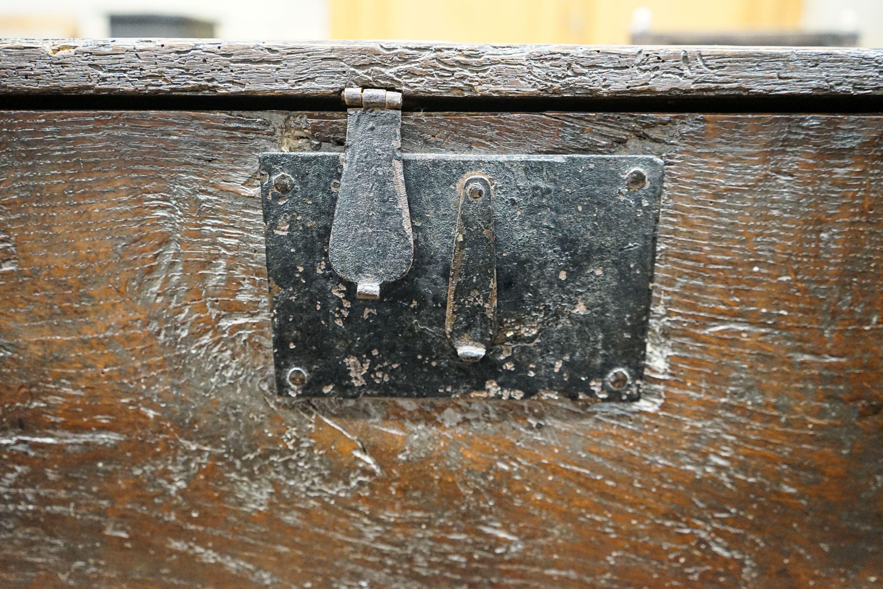 A 17th century oak and elm six plank coffer, width 104cm, depth 36cm, height 54cm